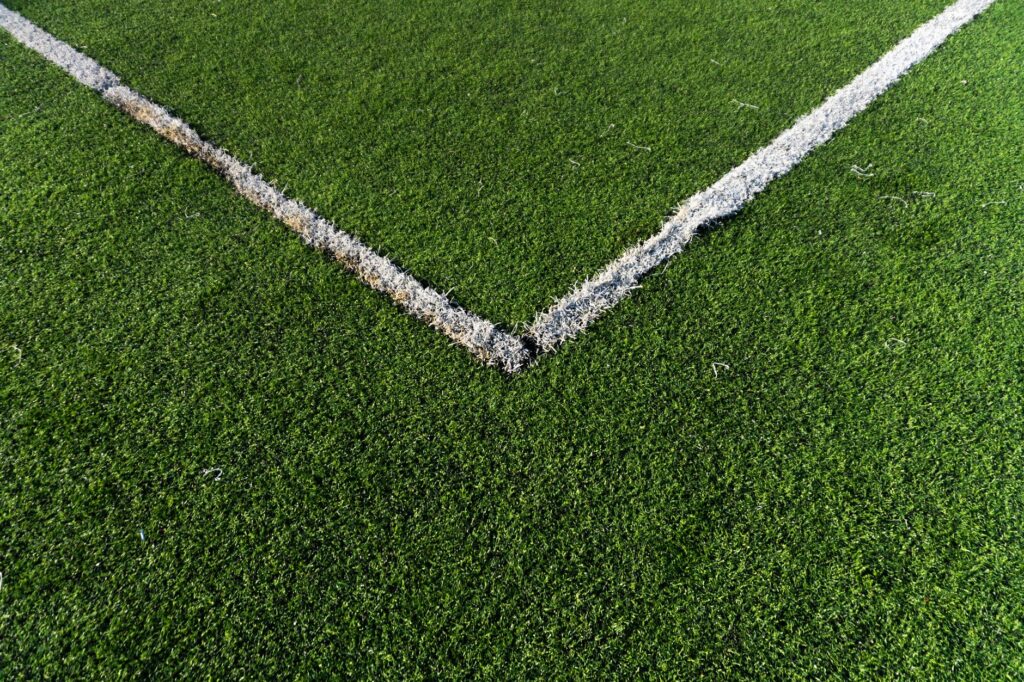 artificial grass worn damaged patch close up repair